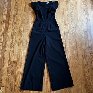 Calvin Klein Elegant Black Jumpsuit with ruffled shoulders